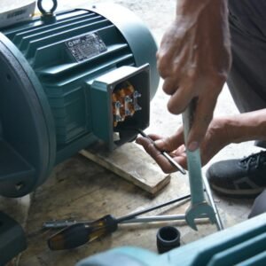 Technician testing an electric motor